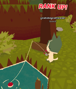 My Webfishing character sitting and fishing. RANK UP is displayed above its head.